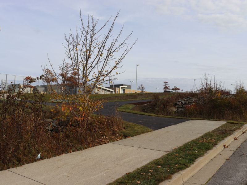 Phase 3 trail on Forest Street. This photo shows the existing sidewalk connect to the trail directly in front of the high school.